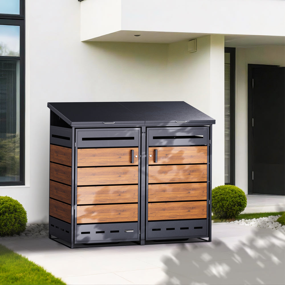 Mülltonnenbox in Holzoptik steht neben modernem Haus in gepflegtem Gartenbereich