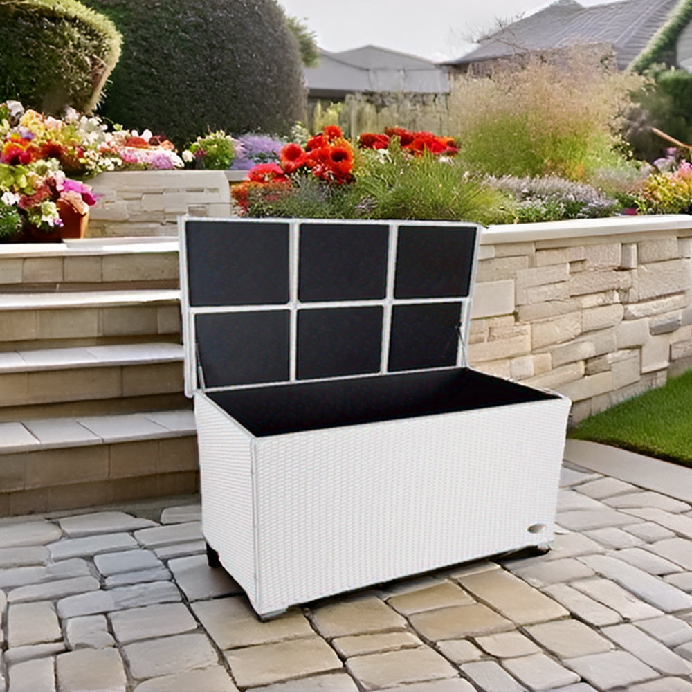 Gartenbox in Natur auf heller Steinfläche, vor Steinmauer.