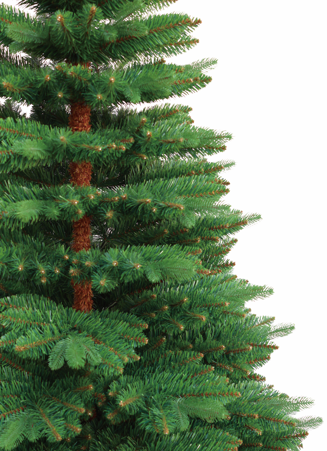 Künstlicher Weihnachtsbaum mit dichten grünen Nadeln und braunem Stamm in Nahaufnahme. 240 cm